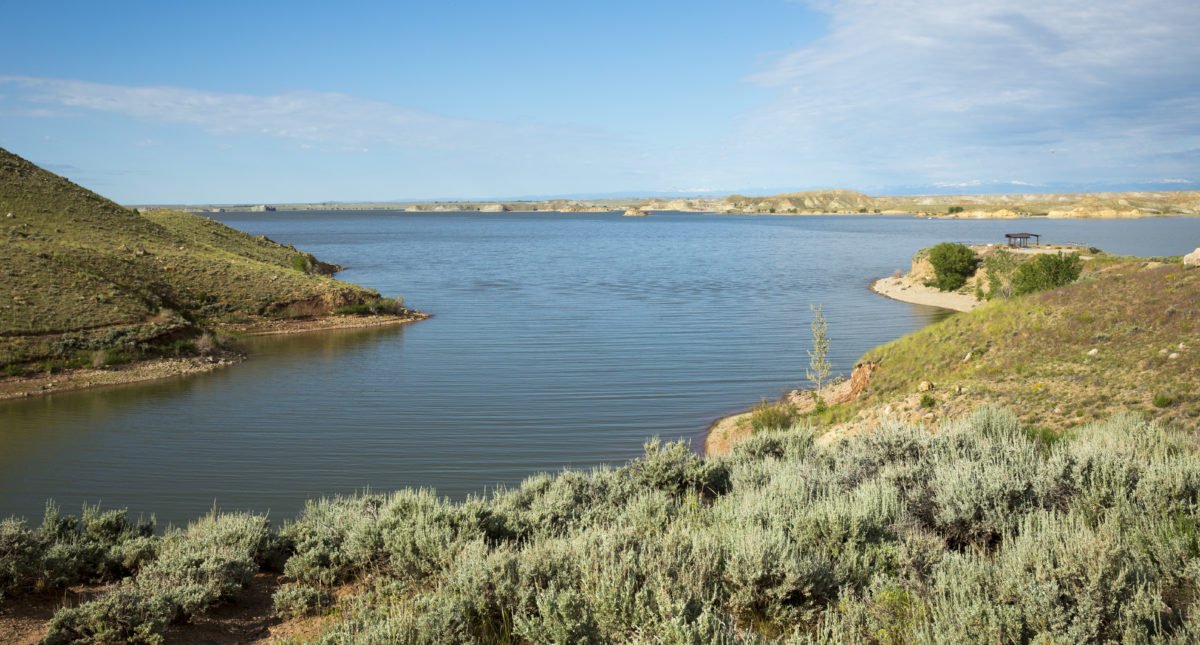 Boysen State Park in Fremont County, Shoshoni, WY, showcasing its tranquil reservoir surrounded by sagebrush and rolling hills.