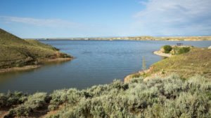 Boysen State Park in Fremont County, Shoshoni, WY, showcasing its tranquil reservoir surrounded by sagebrush and rolling hills.