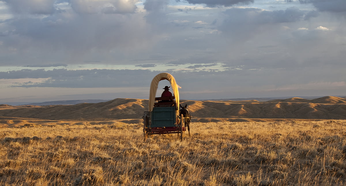 a covered wagon makes its way over prospect ridge
