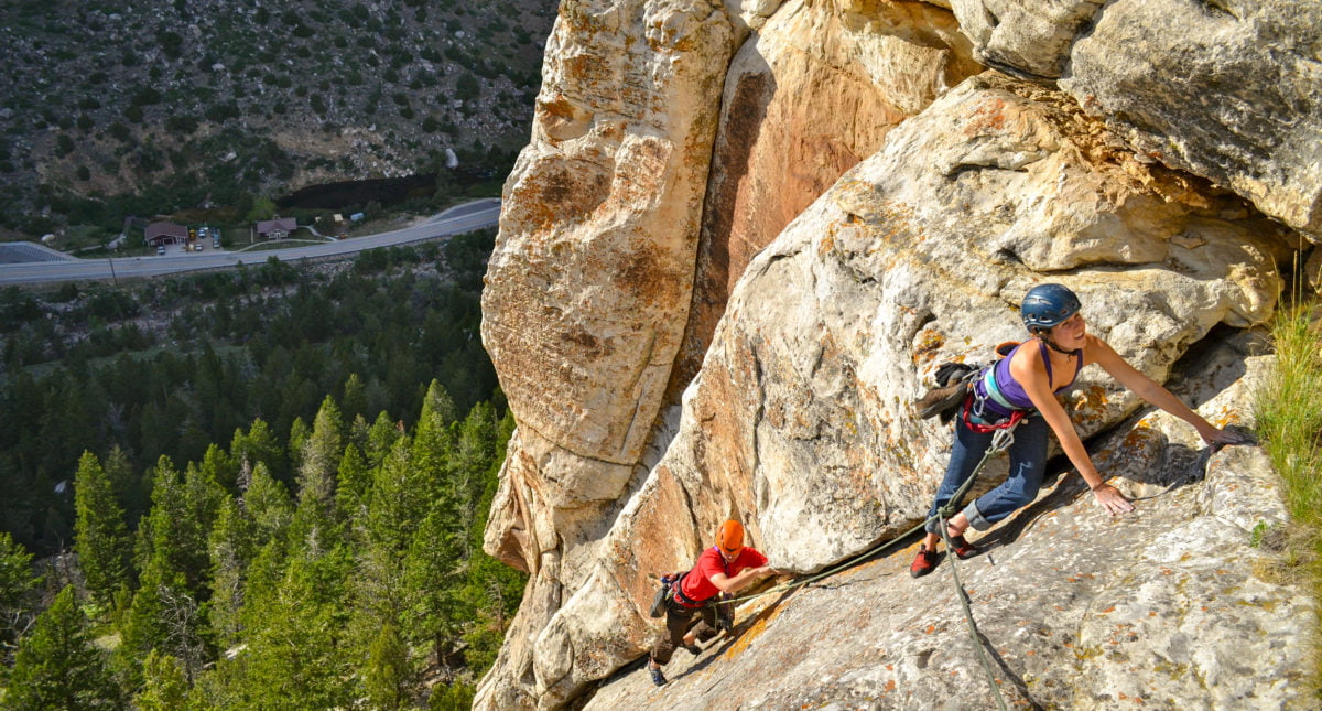 Two climbers make their way up a route in Sinks Canyon