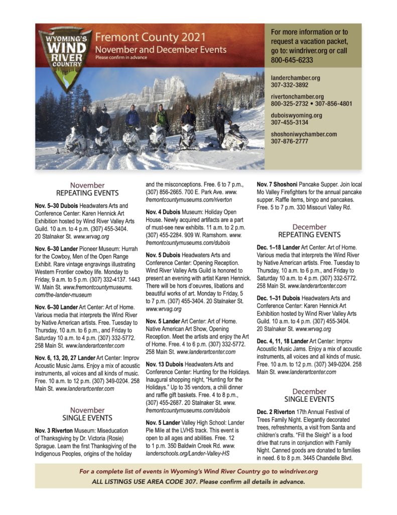 A group of people on snowmobiles in a snowy mountain landscape in Wind River Country.