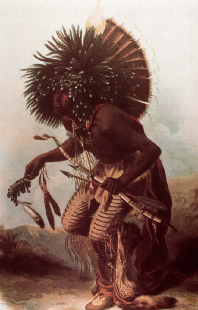 A Native American warrior in traditional attire, adorned with a large feathered headdress, holding a bow and arrows, and wearing beaded moccasins in Wind River Country.