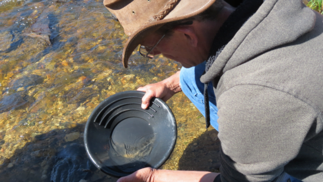 Panning for gold during Gold Rush Days, a top things to do in Atlantic City and South Pass City.