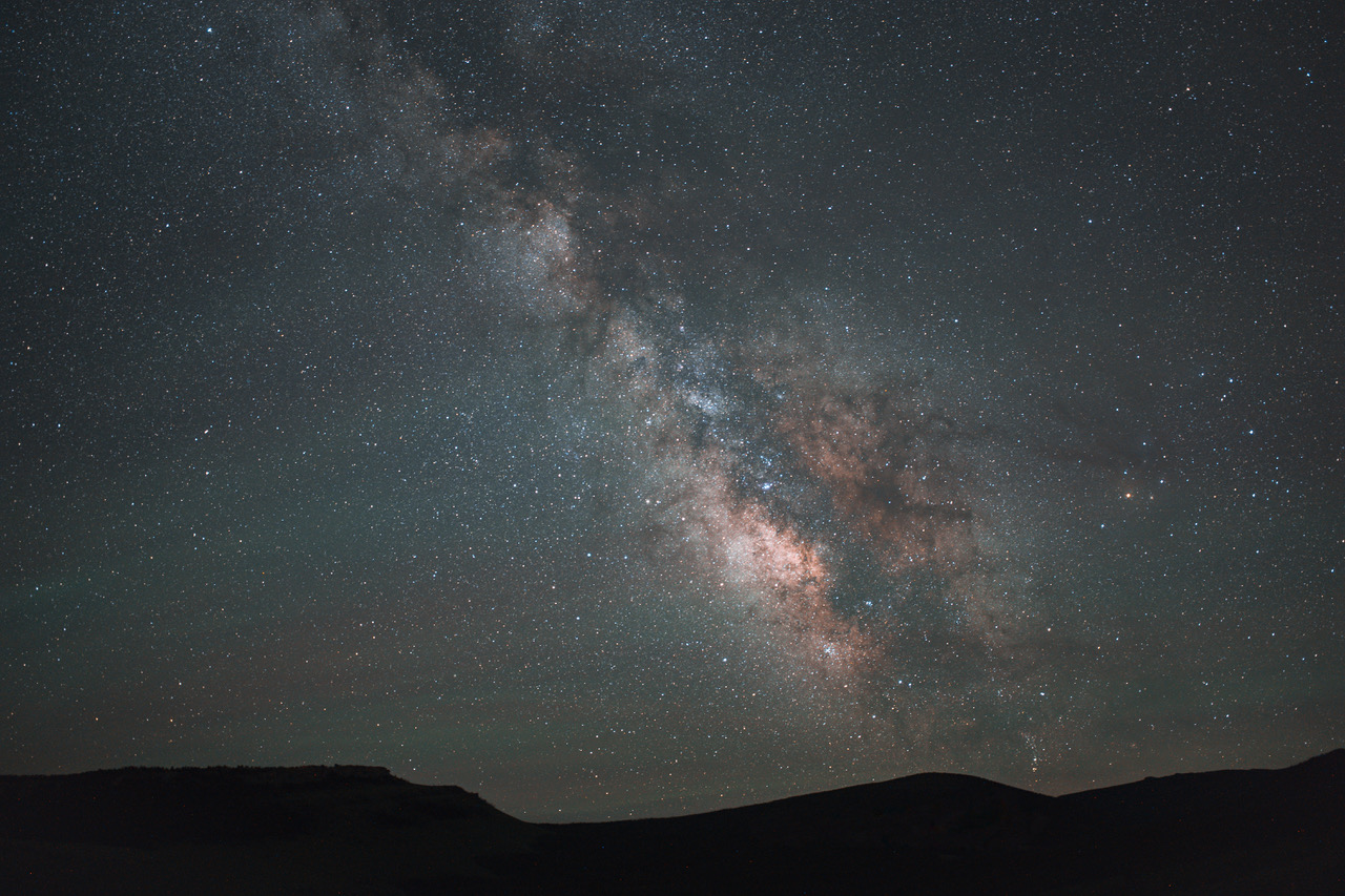 The Milky Way’s vibrant core illuminates the night sky over Wind River Country, one of the best stargazing spots in Wyoming.