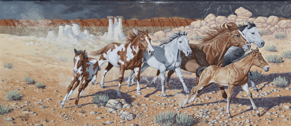 Mural of horses running in Hudson, Wyoming, showcasing local art as one of the unique things to do in Hudson WY.