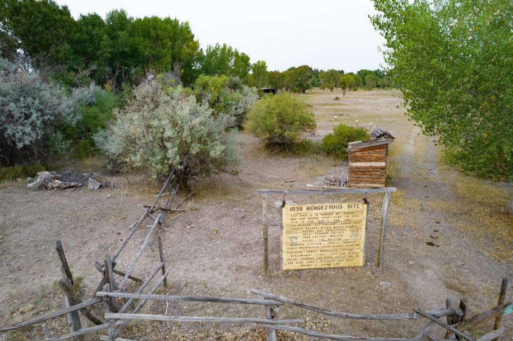 The 1838 Mountain Man Rendezvous Site near Riverton, Wyoming, showcasing rustic fencing and historical significance, one of the top things to do in Riverton.