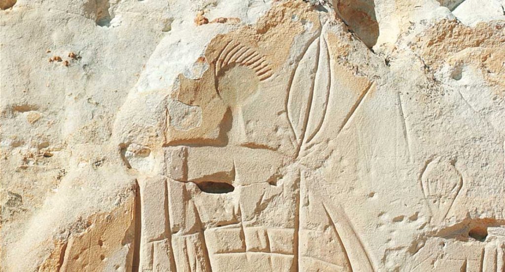 Close-up of intricate petroglyph carvings at Castle Gardens, a unique historical site and one of the most fascinating things to do near Riverton, Wyoming.