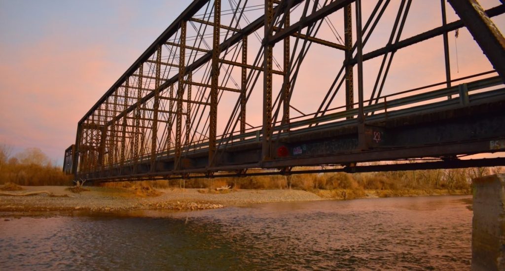 The historic bridge on the Wyoming Heritage Trail at sunset, a scenic and family-friendly thing to do, perfect for hiking and exploring the outdoors in Wyoming.