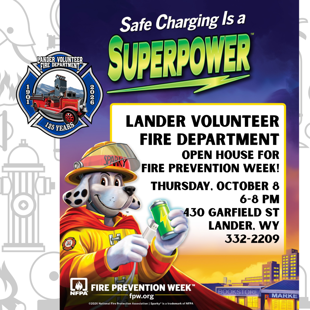 A fire prevention week poster featuring Sparky the Fire Dog holding a battery in Wind River Country.